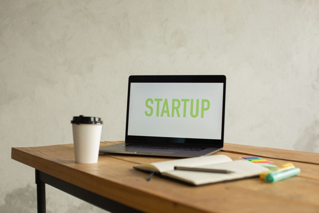 Laptop and coffee on a desk – where Assystant started in 2014