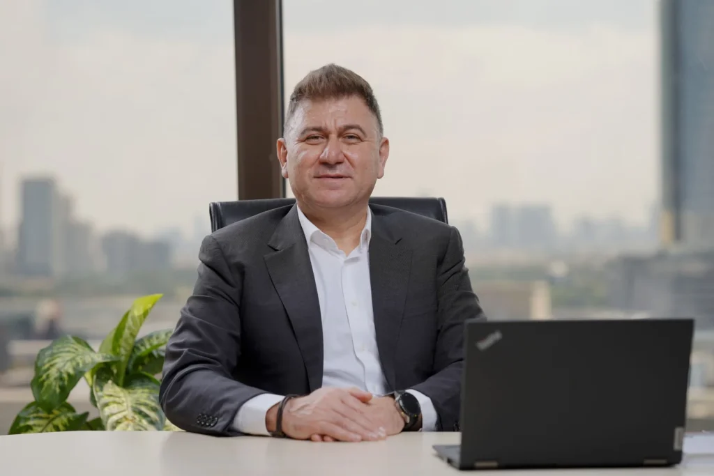 Business leader at his desk reviewing work prepared by AI agents