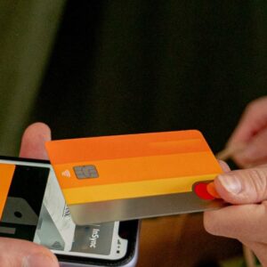 Customer paying by card with a phone